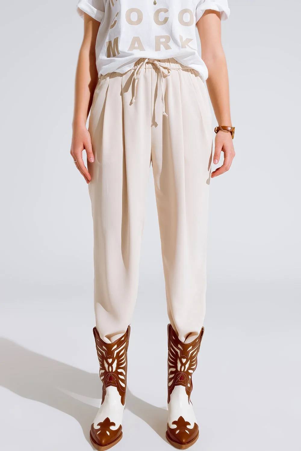 Pants In beige With Front Pockets And Drawstring Closing
