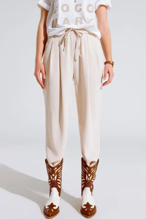 Pants In beige With Front Pockets And Drawstring Closing